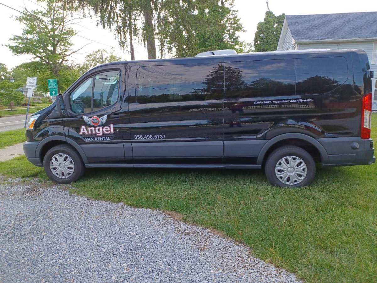 Black 2016 Ford Transit 15-passenger van, side view